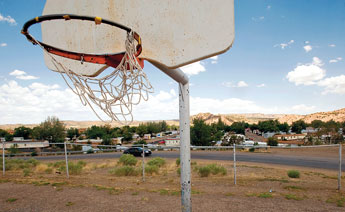 A weathered net blows over Red Hills Trailer Park, Friday in Gallup. © 2011 Gallup Independent / Adron Gardner 